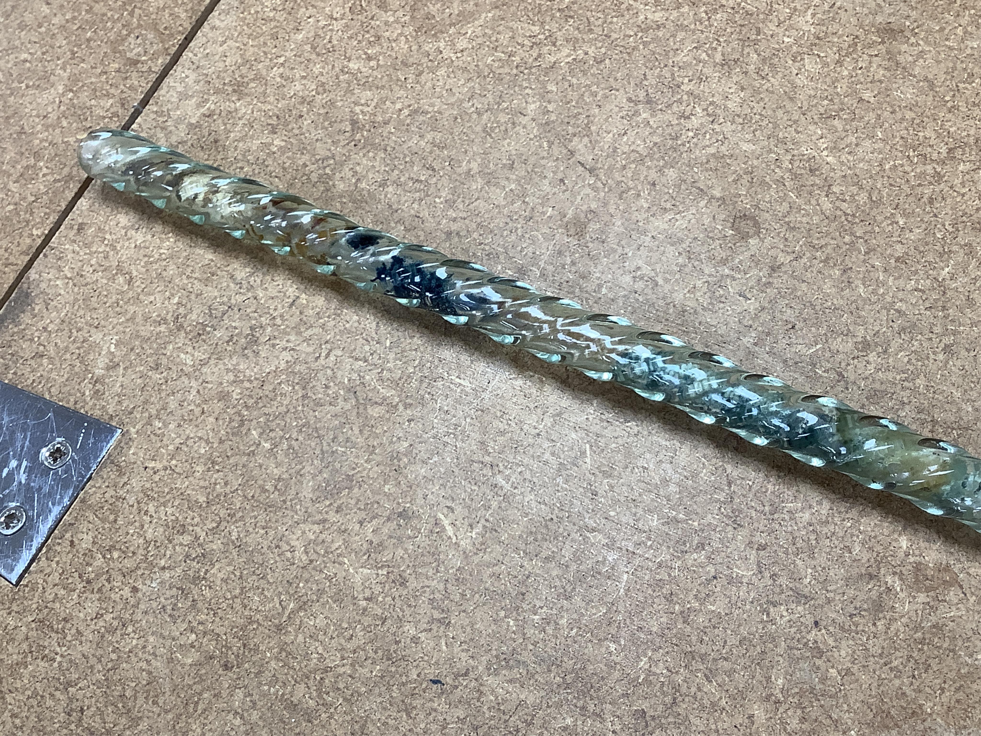 A 19th century Nailsea spiral walking stick, decorated with fine coloured beads, 128cm in length